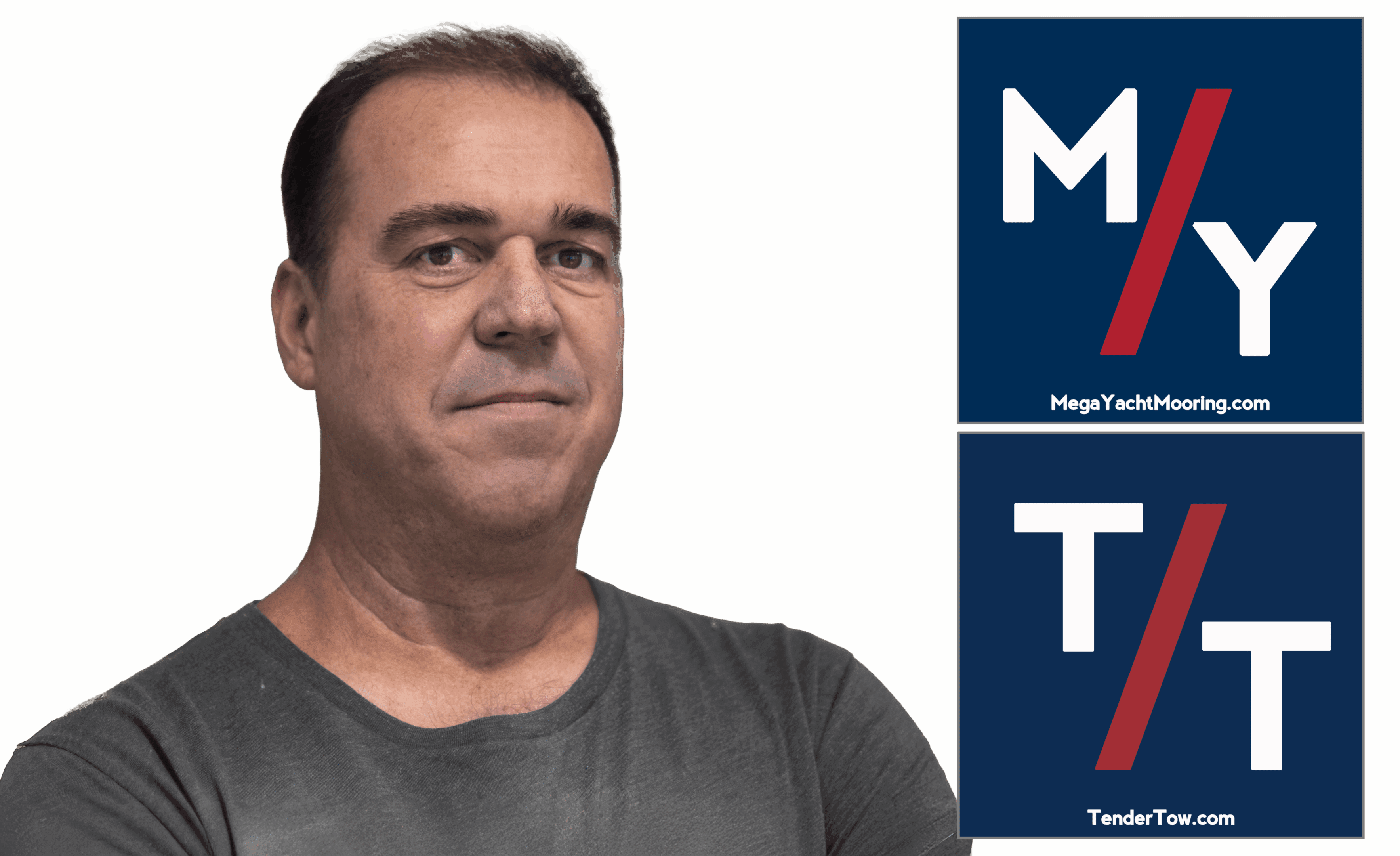 Confident man posing with promotional banners in the background.